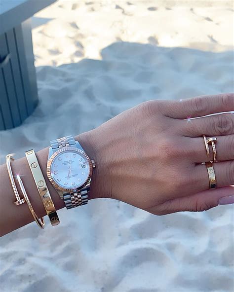 cartier love rings on hand.